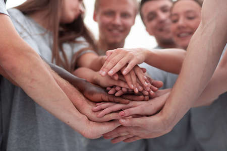 close up. a large stack of hands