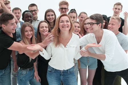 international team of young people congratulating their leader.