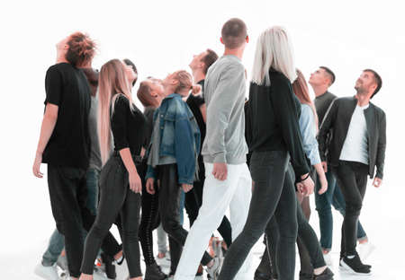 casual young people looking somewhere up. isolated on whiteの写真素材