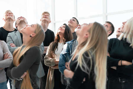 large group of diverse young people looking somewhere upの写真素材