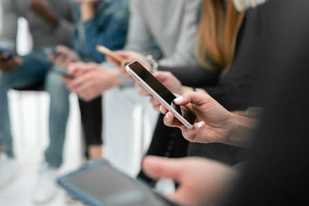 close up. image of a young man reading mail on his smartphone. photo with copy spaceの写真素材