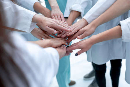 top view. a group of smiling doctors pointing at you. photo with copy spaceの写真素材