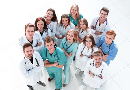 large group of doctors congratulating each other with applauseの写真素材