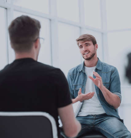 two young men talking in the TV Studioの写真素材