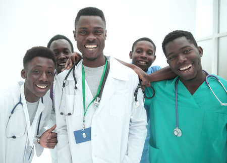in full growth. smiling young doctors standing one by oneの写真素材