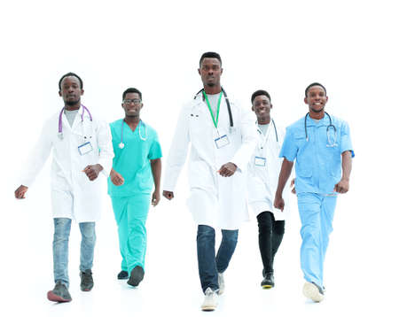 group of different doctors rush to the rescue. isolated on white