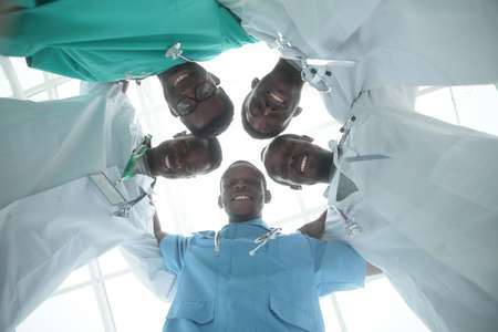 bottom view. group of young doctors standing in a circleの写真素材
