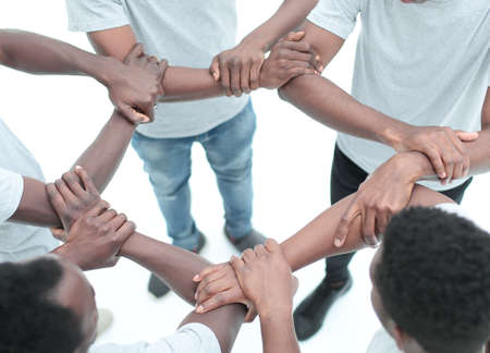 close up. group of diverse guys standing in a circle . isolated on white background