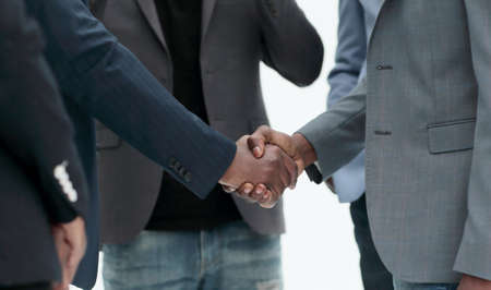 close up. handshake of young business people . isolated on white backgroundの写真素材