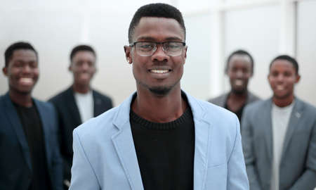 project Manager standing in front of applauding working group.の写真素材