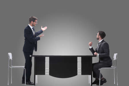 side view. business colleagues discussing something near the desktopの写真素材