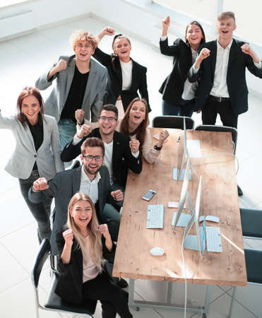 top view. happy business team showing their successの写真素材