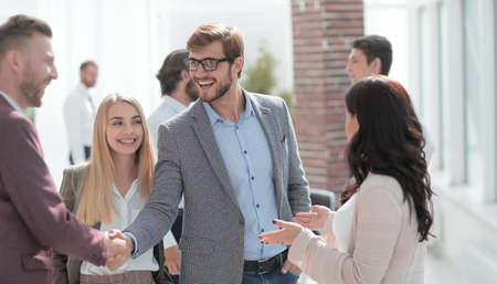 business people greet each other with a handshake.