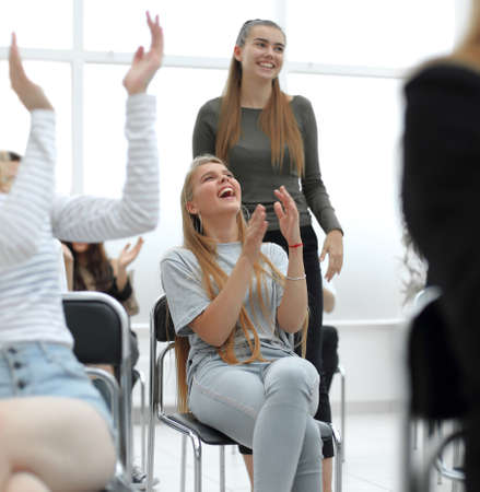 close up. diverse young participants of the workshop, applauded in unison