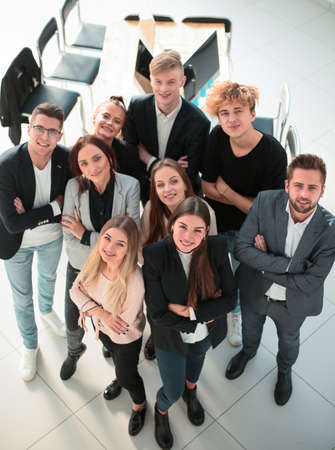 top view. smiling young business team looking at the cameraの写真素材