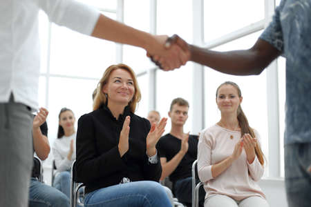business training participants applaud at the seminarの写真素材
