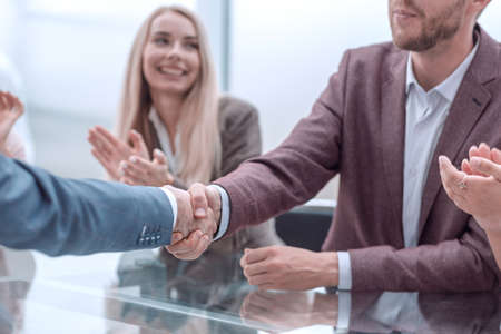 close up. handshake business people over the negotiating table.