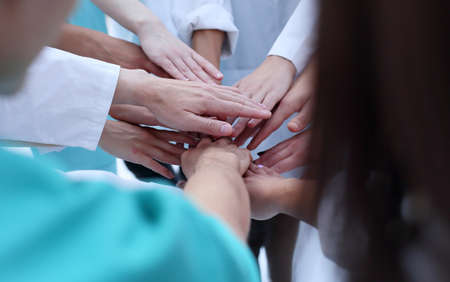 top view. a group of smiling doctors pointing at you.の写真素材