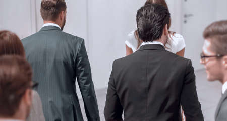 business team walks through the office hall. photo with copy spaceの写真素材