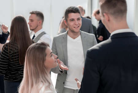 casual business man explaining something to his colleague