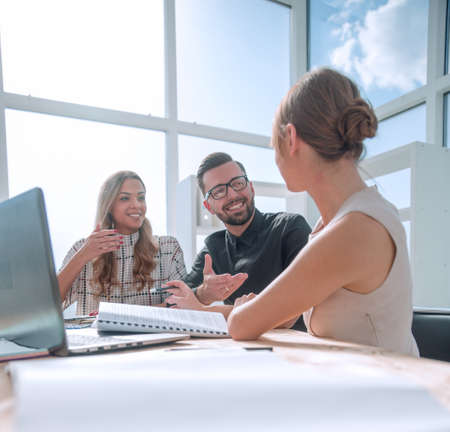 young business woman explaining her ideas at a business meeting.