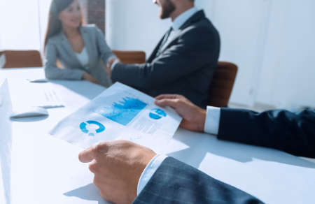 background image .financial graph in hands of the businessmanの写真素材