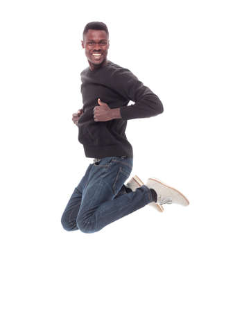 funny guy jumping and giving a thumbs up. isolated on whiteの写真素材