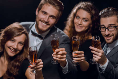 closeup.best friends with a glass of wine.の写真素材