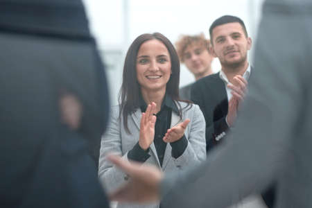 group of young business people applauding togetherの写真素材