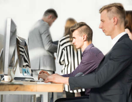 business man explaining something to his colleaguesの写真素材