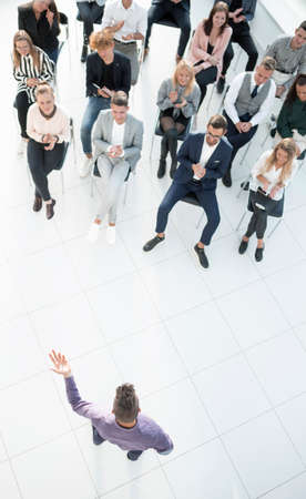 top view. listeners applauding the speaker at a business seminar. business and educationの写真素材