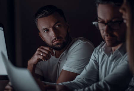 close up.tired employees working overtime.の写真素材