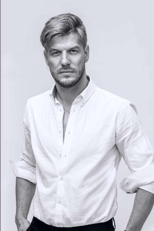 Black and white portrait of handsome man looking at cameraの写真素材
