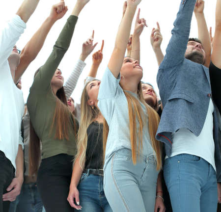 group of youth standing together and showing upの写真素材
