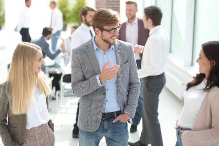group of employees talking standing in the office.の写真素材