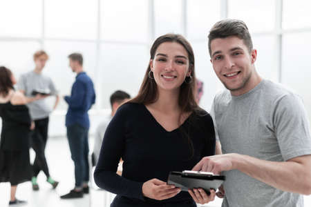 young colleagues with business documents standing together.