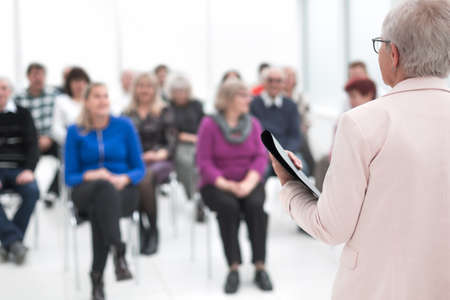 Female business executive giving a speech at a officeの写真素材