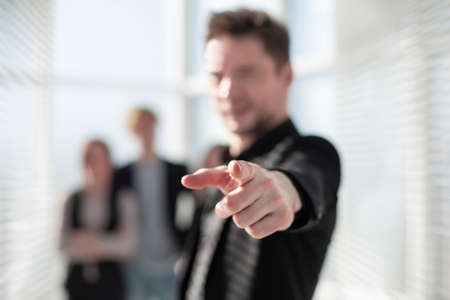 Happy businessman in office thumbs upの写真素材