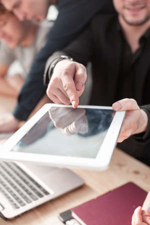 man holding digital tablet, closeupの写真素材