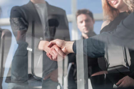 Architect and engineer construction workers shaking handsの写真素材