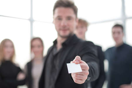 Businessman showing blank business cardの写真素材