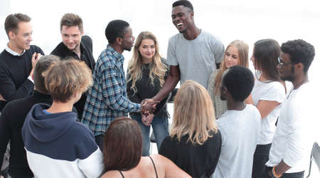 participants of the workshop, shaking hands with each otherの写真素材