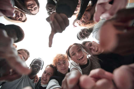 close up . many odiverse young people are pointing at youの写真素材