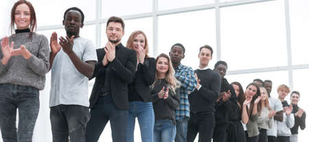 diverse young people applaud standing in lineの写真素材