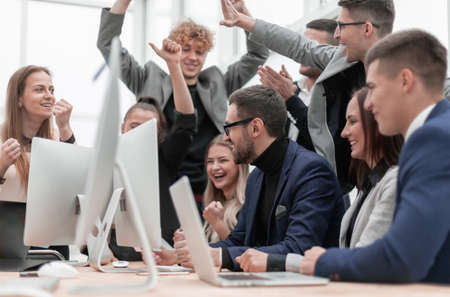 excited business team is jubilant in the workplace.の写真素材