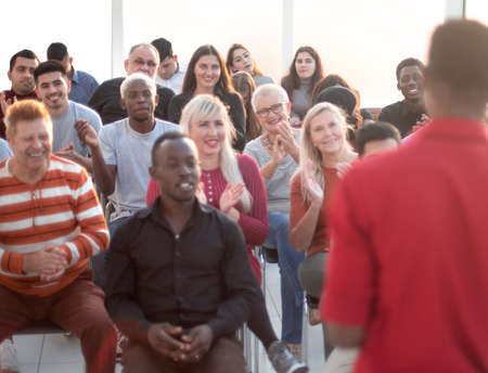 young speaker greeting the audience in the conference room.の写真素材