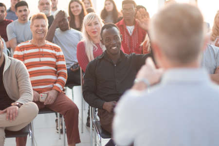 Rear view of speaker giving a talk on corporate business meetingの写真素材