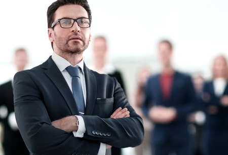 Businessman standing near the window and looking into itの写真素材