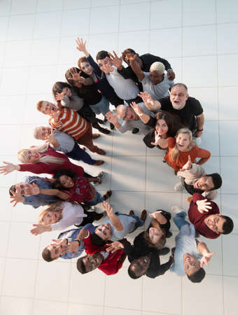 international group of happy people standing in a circle.の写真素材