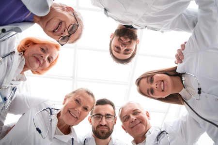 close up. group of scientists and doctors standing in a circle .の写真素材